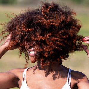 COILBAR Textured Haircare: woman shaking her type 4 hair